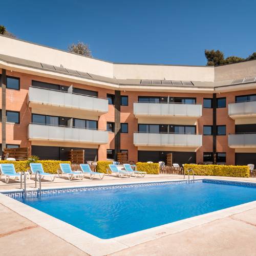 Outdoor swimming pool SANTA SUSANNA Chic! Apartments  Santa Susanna