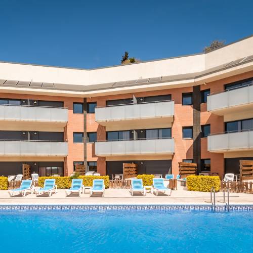 Outdoor swimming pool SANTA SUSANNA Chic! Apartments  Santa Susanna